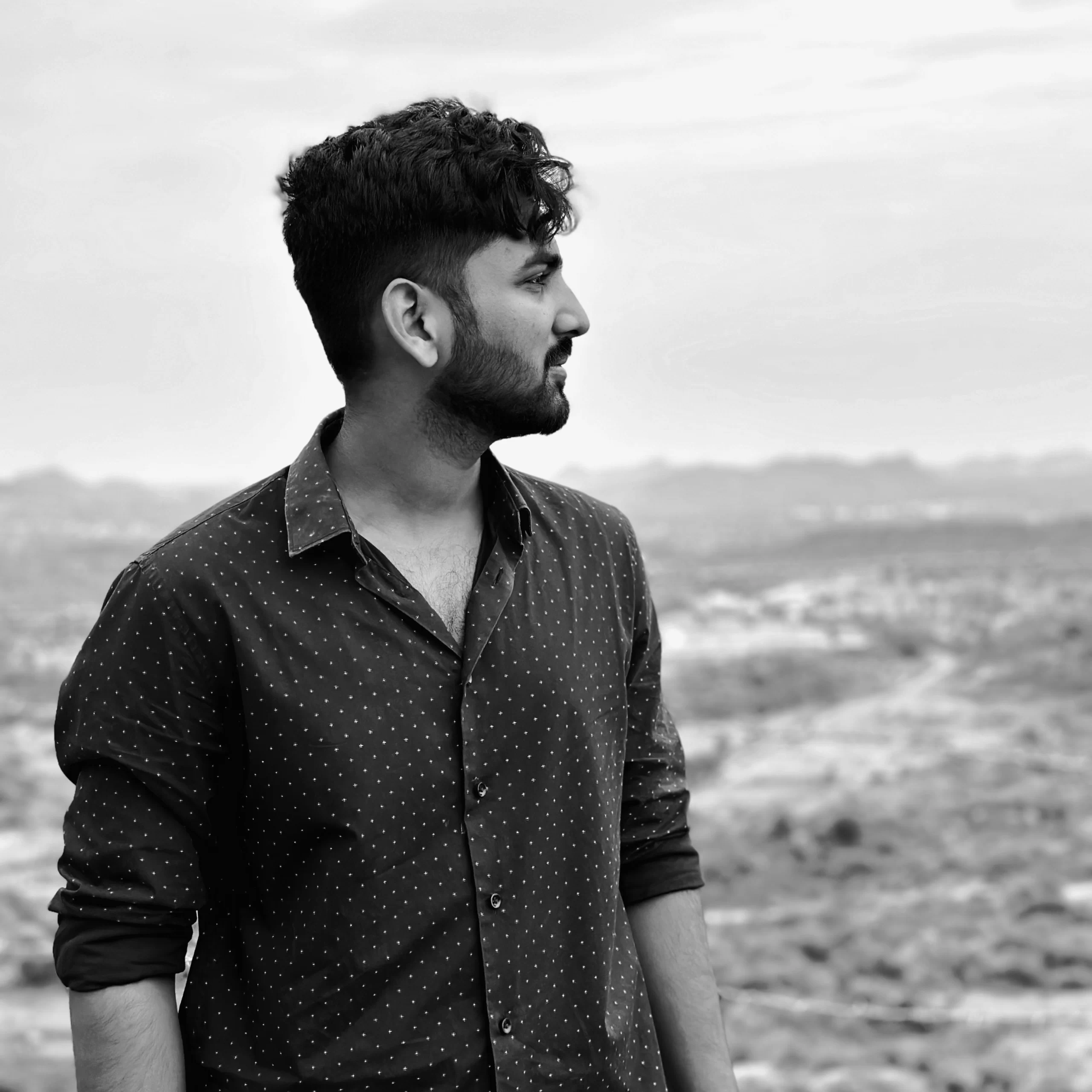 Abhinay Krishna in blue shirt in black and white