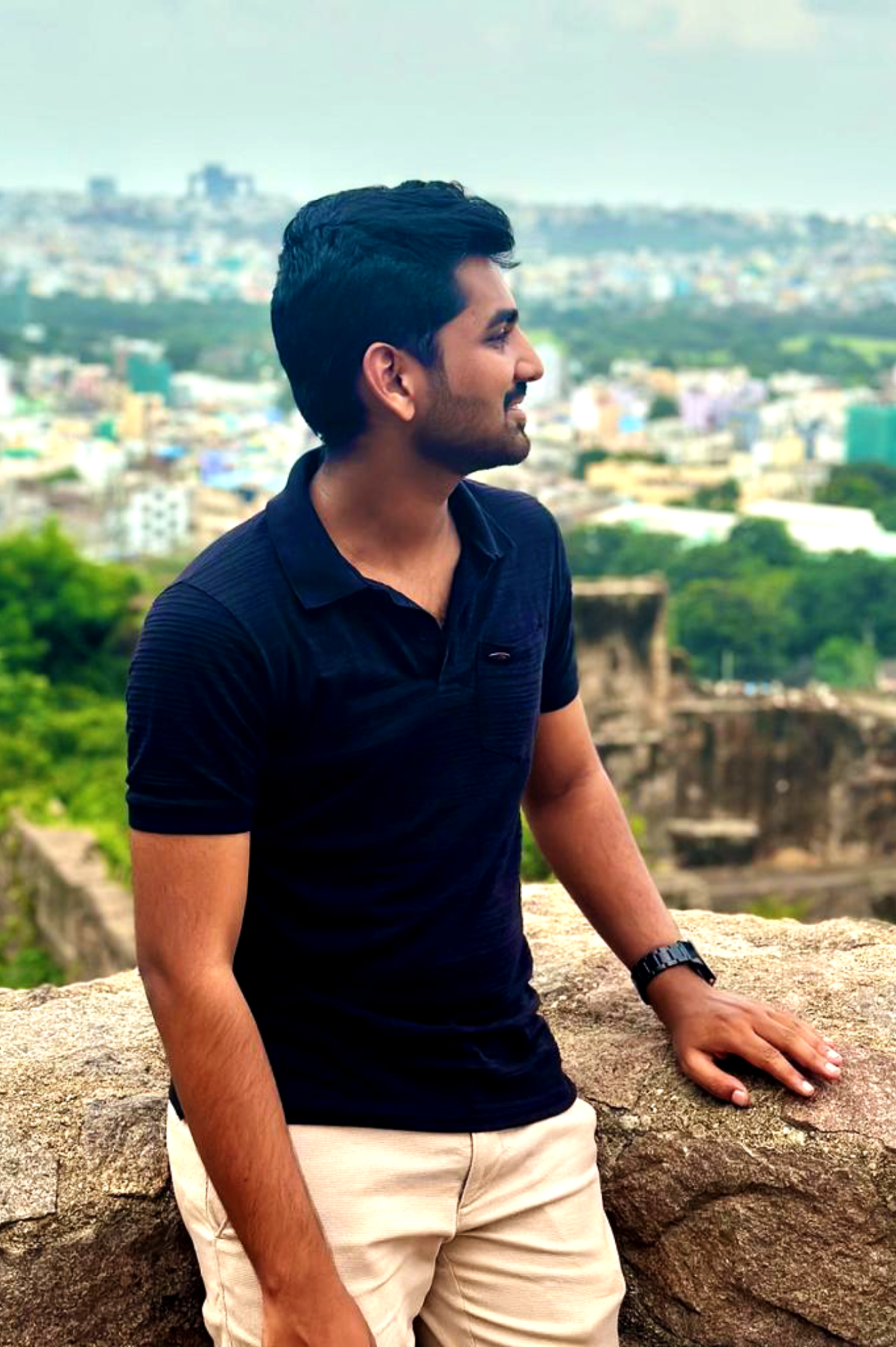 Abhinay Krishna looking on his left in black T-Shirt